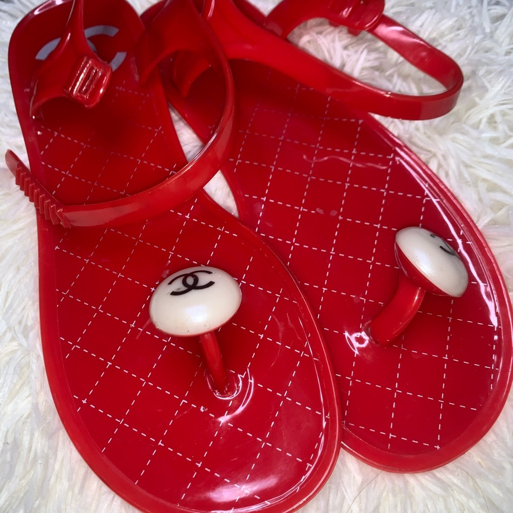 Red CC jelly sandals.